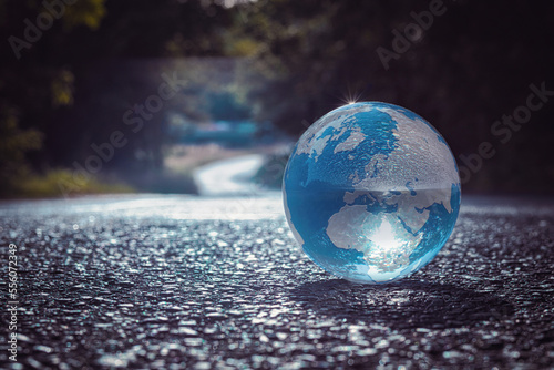 Fototapeta Naklejka Na Ścianę i Meble -  Erdball - Strasse - Ecology - Earth - Lensball - High quality photo - Bioeconomy - A closeup of lensball with reflection planet on ground	