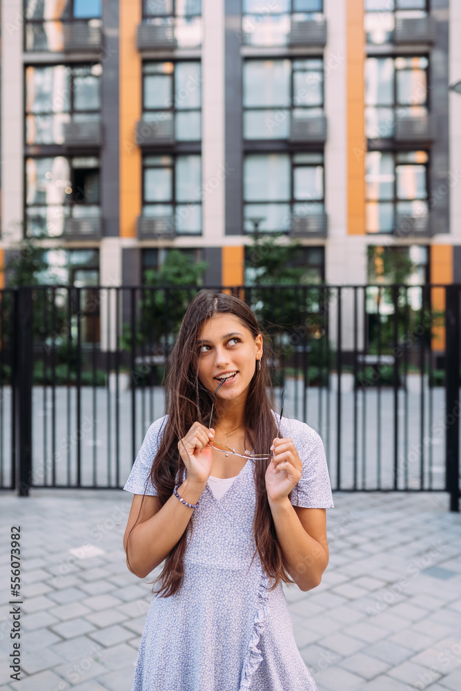 Woman on the background of large building Woman on the background of large building
