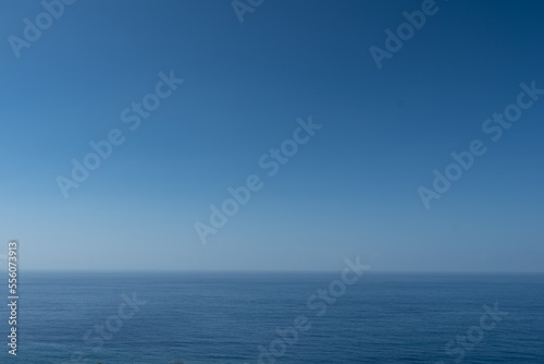 Wallpaper Mural Blue ocean or sea background with blank space. Blue sky above calm water Torontodigital.ca