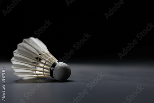 Slow motion of a Shuttlecock falling on a black background. Black background.