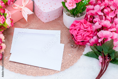 White blank greeting card surrounded by colorful decoration with valentine themed