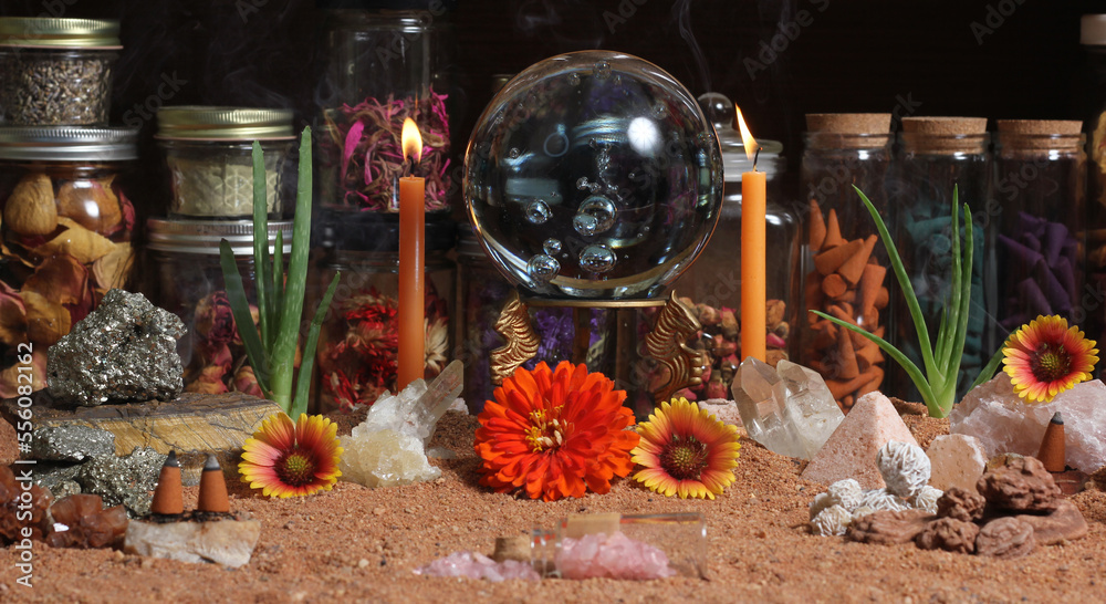 Crystal Ball With Candles and Chakra Stones on Australian Red Sand