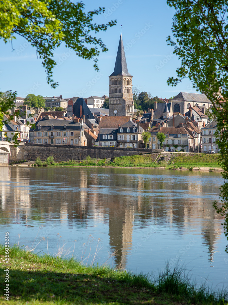 The steeple of the Priory of La-Charité-sur-Loire, France, seen from an island across one branch of the Loire River