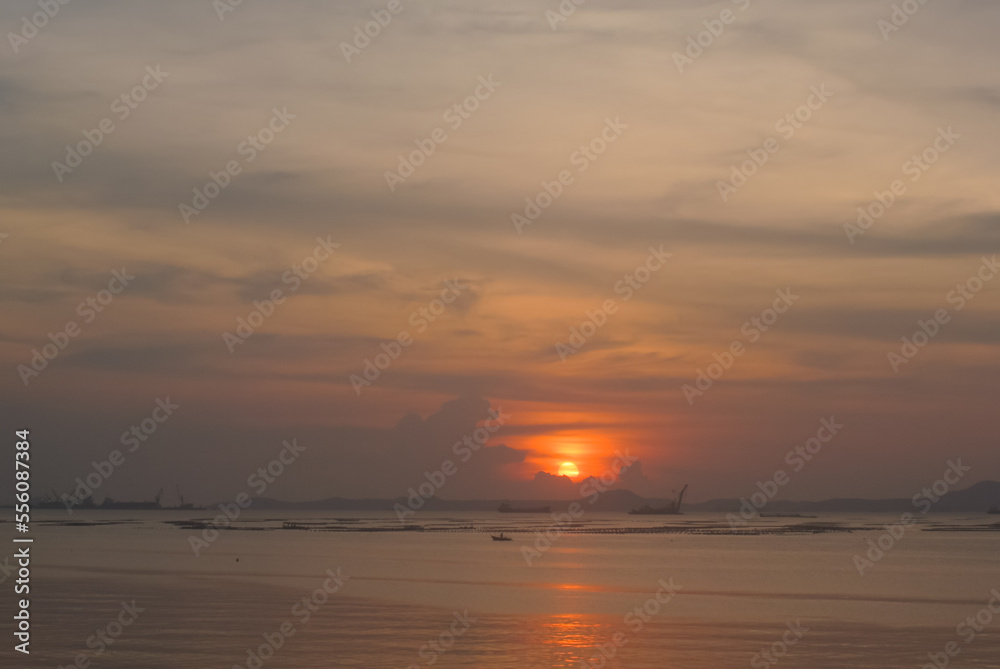 Sunset sky at sea with Koh Si Chang island background