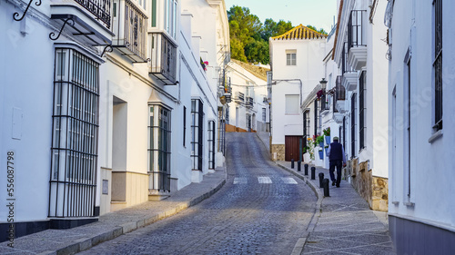 Man walking through the narrow streets of the white and picturesque village of Medina Sidonia  Cadiz.