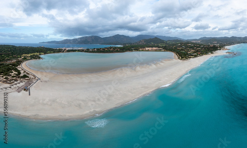 Fototapeta Naklejka Na Ścianę i Meble -  aerial panorama of Capo Carbonara and the beach and lake near Villasimius in southeastern Sardinia