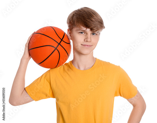 Teenage boy with basketball ball on white background