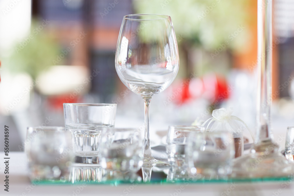 Wine glasses and goblets are placed on the table at the ceremony. beautifully arranged ready for table participants to dine. Wine glasses and goblets are placed on the table at the ceremony. beautifully arranged ready for table participants to dine.