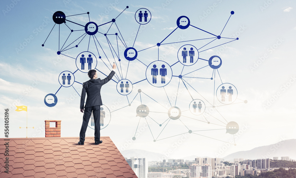 Businessman on house roof presenting networking and connection c Businessman on house roof presenting networking and connection c