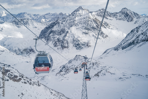 PITZTAL GLACIER, AUSTRIA - 21.12.22: Gondola cable car and ski slopes in the mountains of Pitztal winter resort, Austrian Alps 