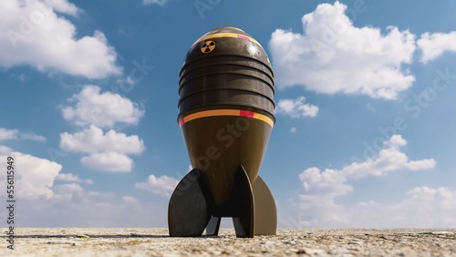 Nuclear bomb, atomic missile on the ground, against a blue cloudy sky, 3d render photo
