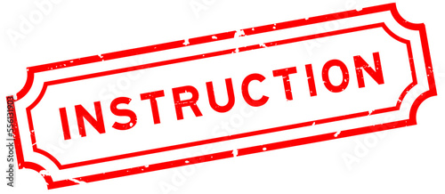 Grunge red instruction word rubber seal stamp on white background