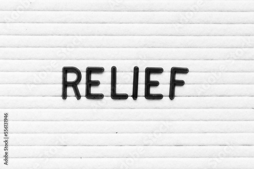 Black color letter in word relief on white felt board background