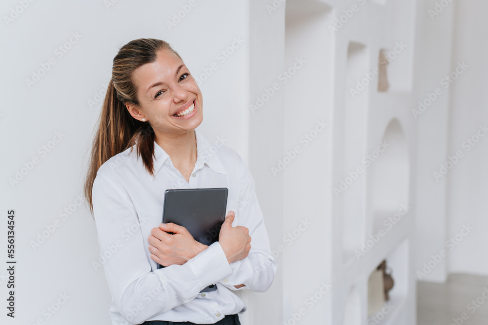 Attractive excited hispanic manager woman in glasses wearing white shirt and black pants holding laptop looking aside dreamily. Beautiful italian young student girl. Mockup, business, financial people Attractive excited hispanic manager woman in glasses wearing white shirt and black pants holding laptop looking aside dreamily. Beautiful italian young student girl. Mockup, business, financial people