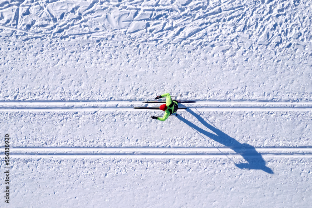 Winter sports competitions, cross country skis glide on fresh snow, aerial top view - obrazy, fototapety, plakaty 