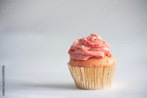 Sweet strawberry cupcakes in white background