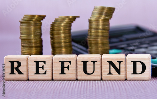 Wallpaper Mural REFUND - word on wooden cubes on the background of coins and calculator Torontodigital.ca