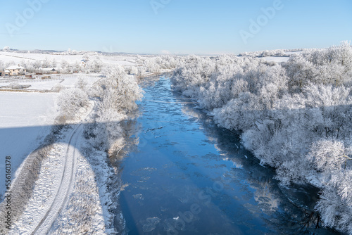 Snow and ice around he River Teviot from Roxburgh Viaduct in the Scottish Borders photo