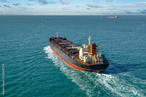 Impressive aerial view of a giant freighter crossing the ocean