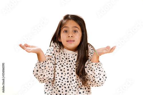 Beautiful young model posing with questioning or confused expression for child innocence and curiosity. Generic white background
