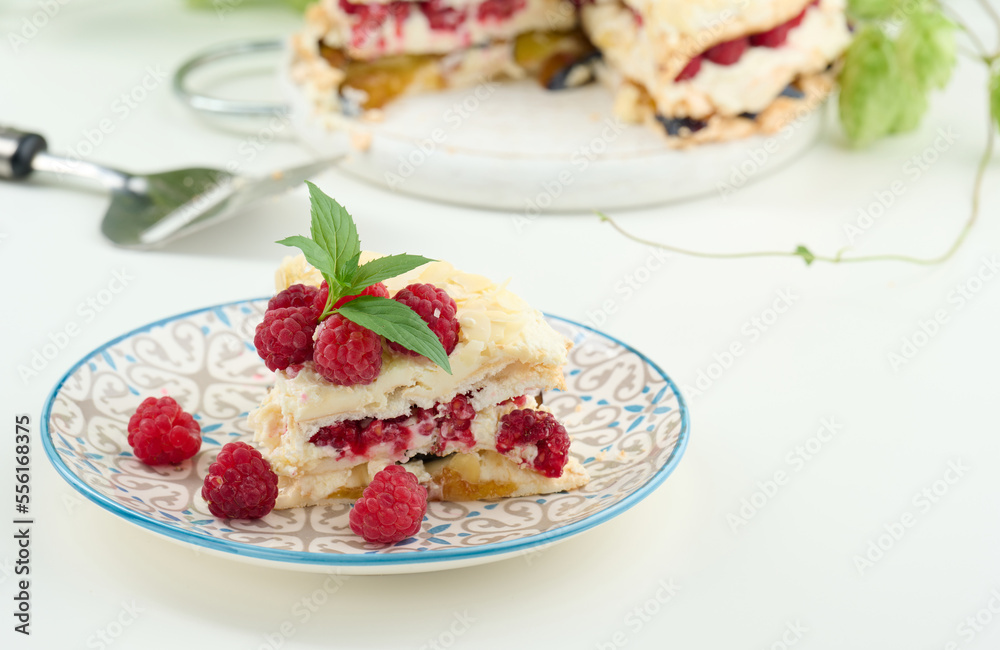 Round meringue pie with fresh raspberries on a white background, Pavlova dessert Round meringue pie with fresh raspberries on a white background, Pavlova dessert