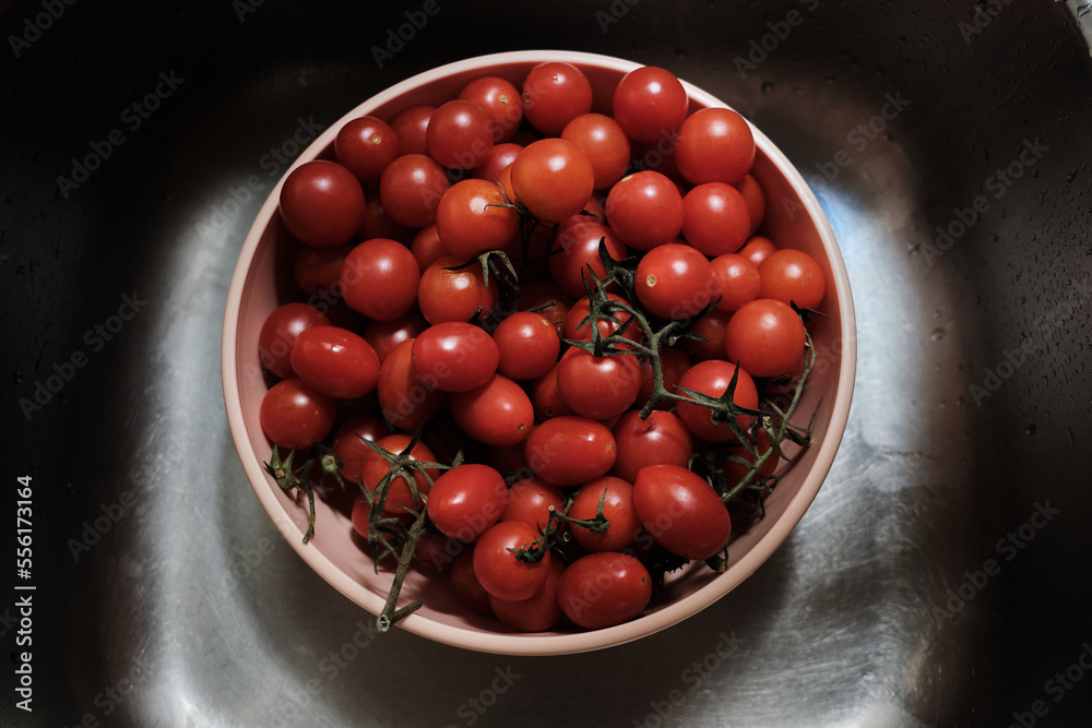 close up many cherry tomatoes in the sink close up many cherry tomatoes in the sink