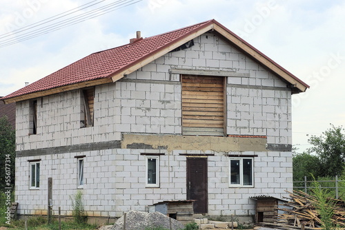 Wallpaper Mural one private house of white bricks with windows under a brown tiled roof on the street in green grass Torontodigital.ca