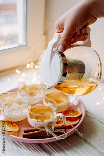 pouring tea into glass