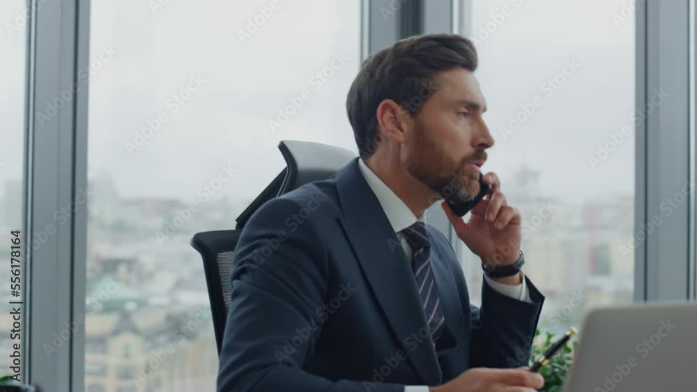 Financial manager consulting phone sitting luxury office close up. Man talking. Financial manager consulting phone sitting luxury office close up. Man talking.