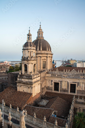 View at Catania Cathedral and Ionian sea from the dome of the Abbey of St Agatha at sunset, Sicily, Italy