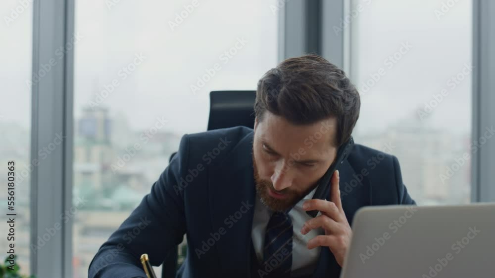 Busy employee talking phone with boss noting work issues in notebook close up. Busy employee talking phone with boss noting work issues in notebook close up.