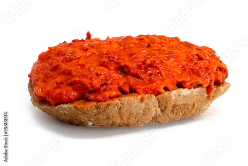 Ajvar roasted red peppers spread on bread isolated on white background high quality details photo