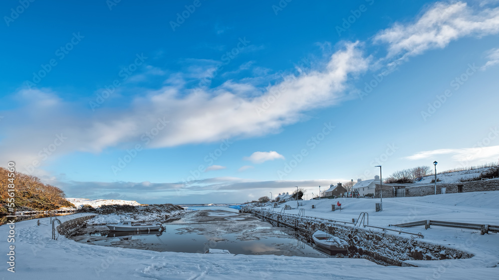 Brora harbour with winter snow and blue sky Brora harbour with winter snow and blue sky