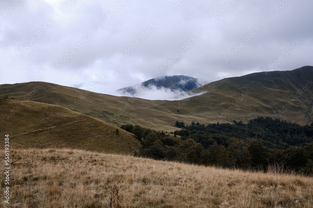 Mountain landscape.
Beautiful sunny day in the mountains.
Low clouds in mountains
Carpathian mountains in Romania