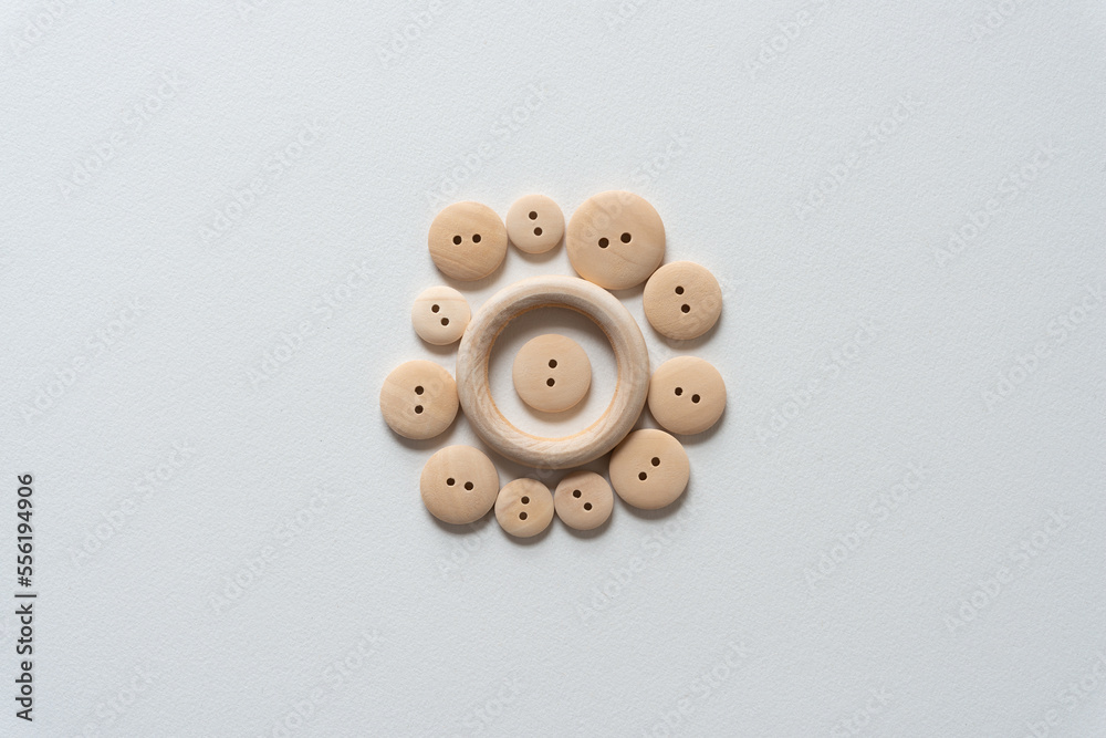 wooden buttons and ring on paper wooden buttons and ring on paper