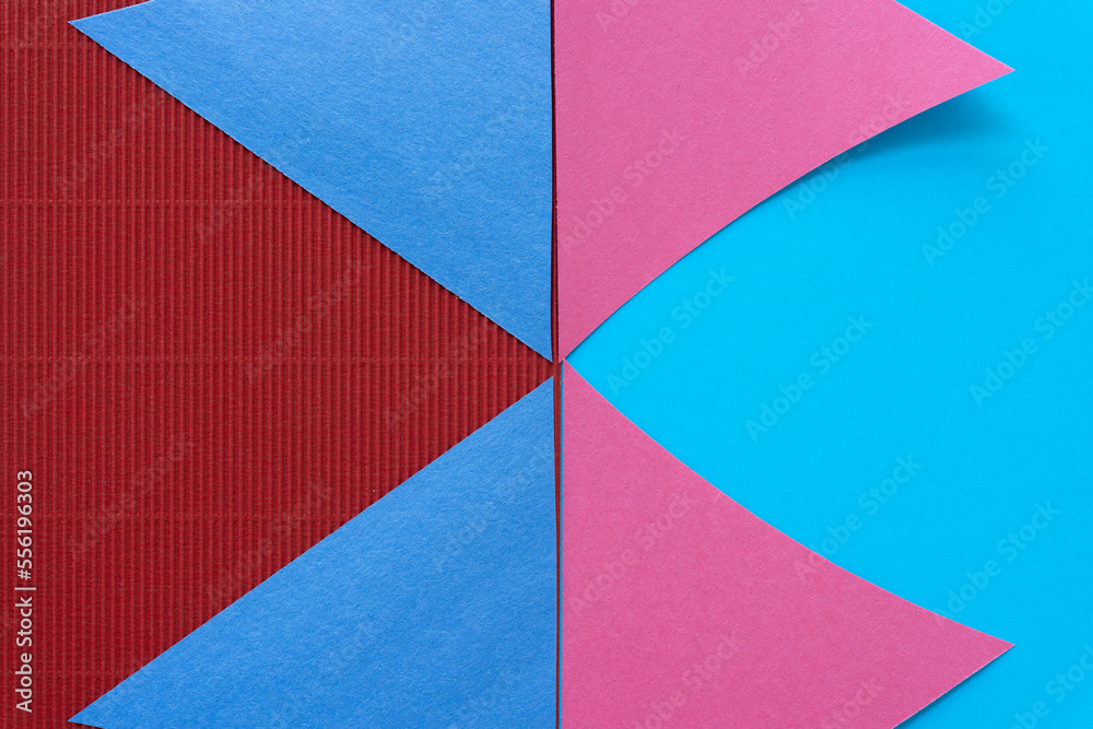 triangle paper shapes on smooth blue and red corrugated paper triangle paper shapes on smooth blue and red corrugated paper