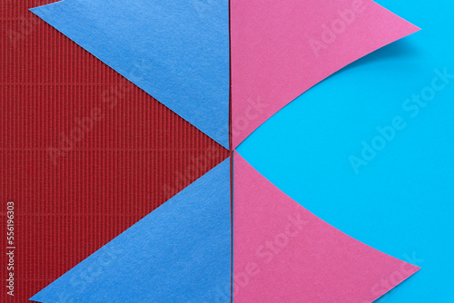 triangle paper shapes on smooth blue and red corrugated paper