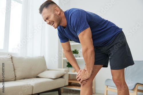 Man leg pain from exercising at home, workout injury, muscle and ligament sprain, bruise