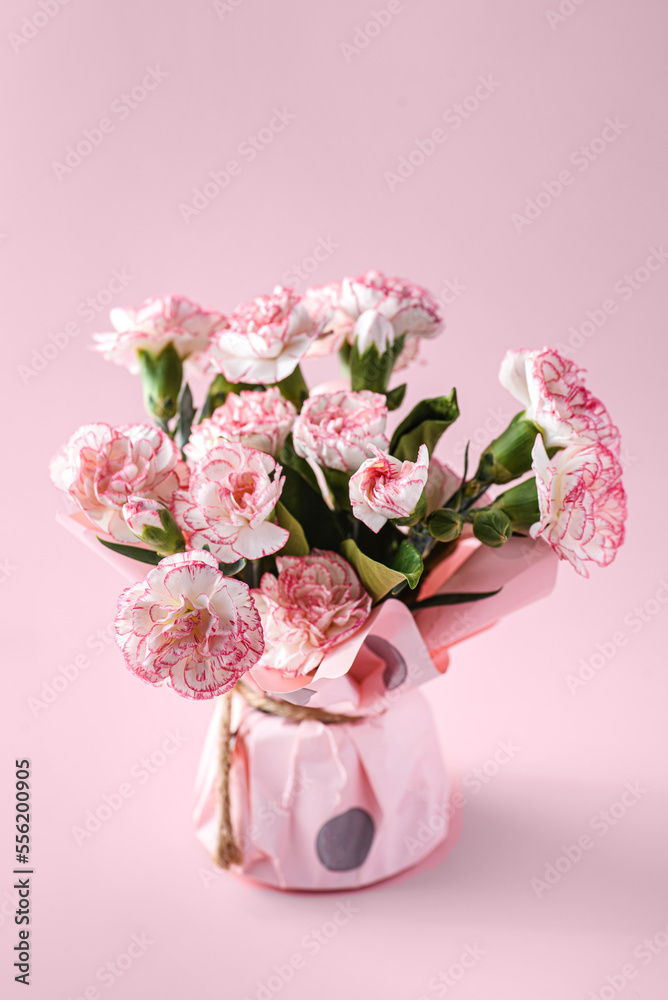 bouquet of flowers on a pink background