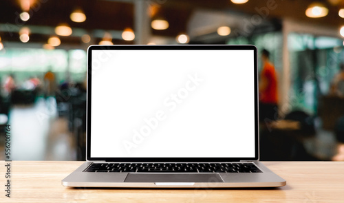 Laptop blank screen on wood table with coffee cafe background, mockup, template for your text, Clipping paths included for background and device screen