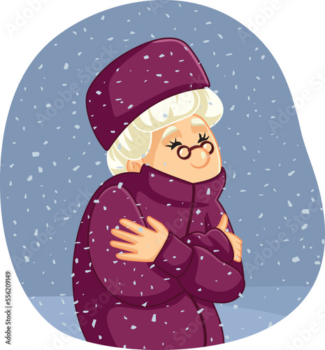Elderly Woman Feeling Cold Outdoors During Winter Vector Cartoon. Granny walking outside in bad weather in wintertime 

