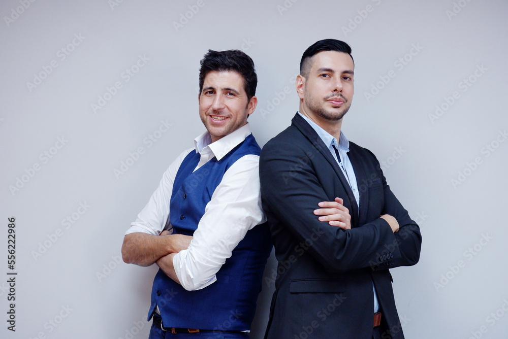 Handsome young businessman in suit smiling on white background. Business concept. Handsome young businessman in suit smiling on white background. Business concept.