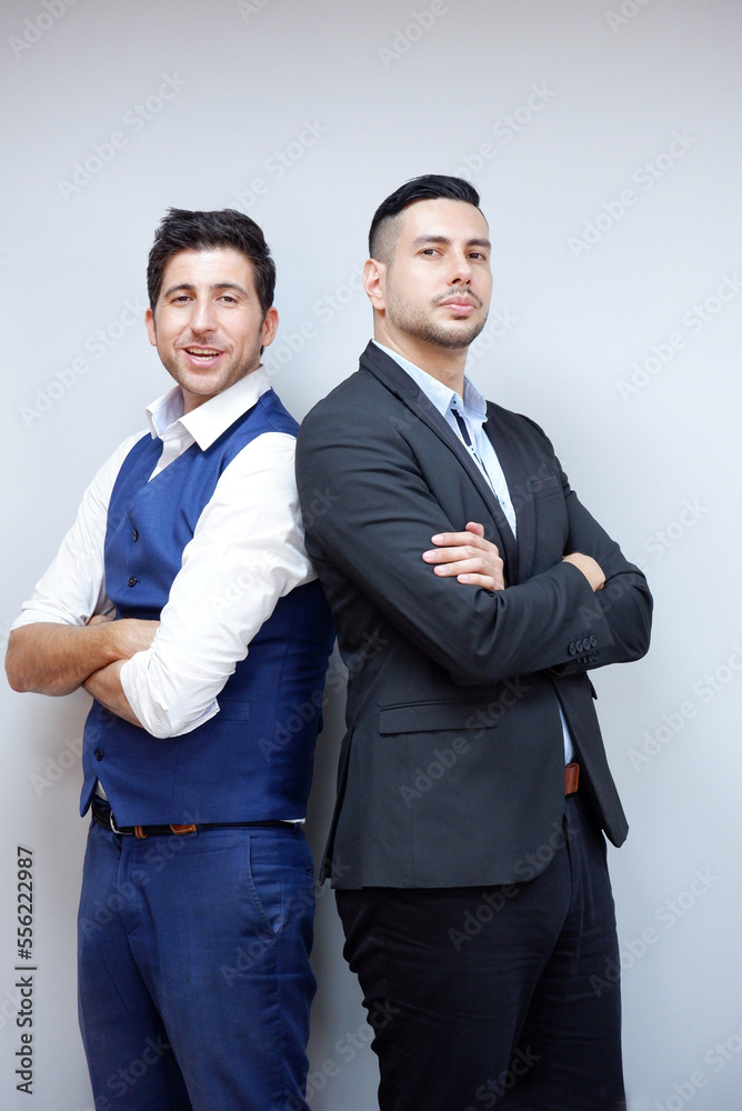 Handsome young businessman in suit smiling on white background. Business concept. Handsome young businessman in suit smiling on white background. Business concept.