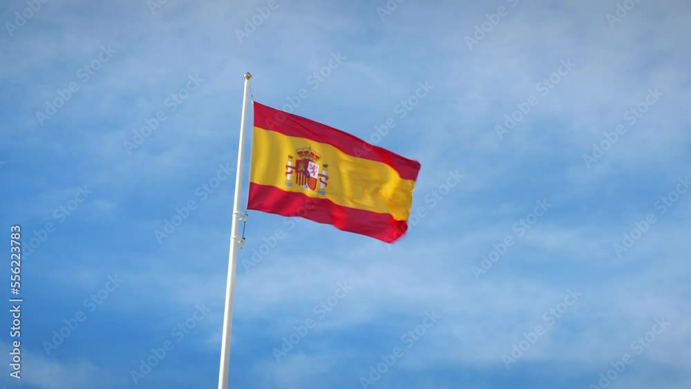 Spanish flag moved by wind, closeup.National flag of Spain waving in strong wind Spanish flag moved by wind, closeup.National flag of Spain waving in strong wind