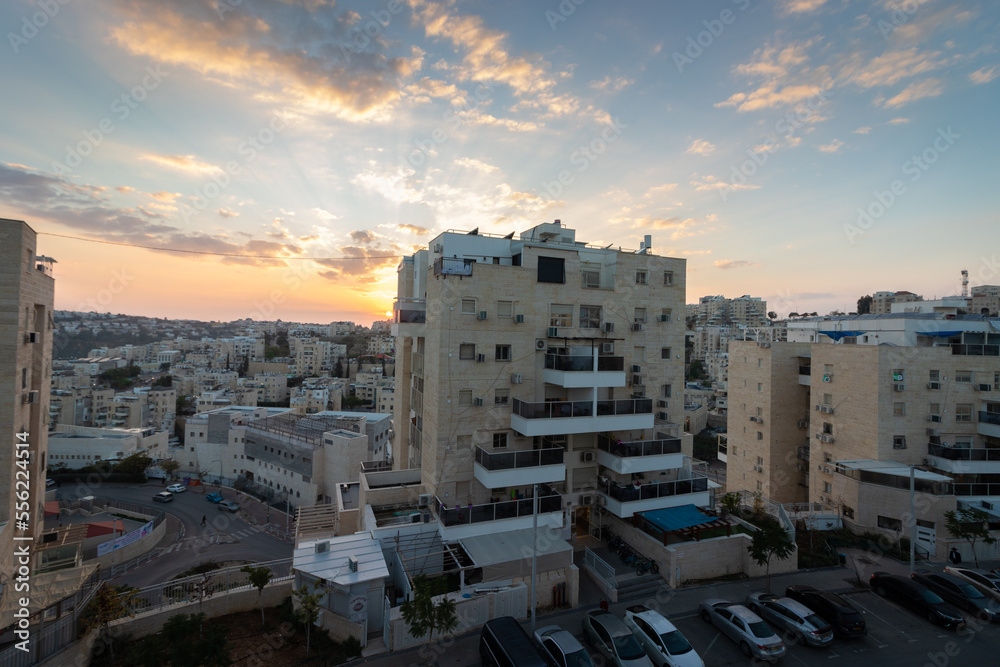 modiin ilit - israel. 22-12-2022. A view from above of buildings inside a residential neighborhood in Kiryat Safar. Israel. Sunset background