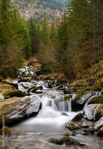 a stream that flows in the mountains in late autumn