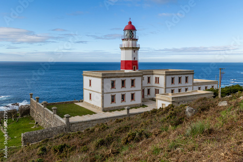 Baiona, Spain - December 05, 2022: maritime lighthouse in the atlantic ocean called faro silleiro, tourist place, in the town of Baiona, Spain