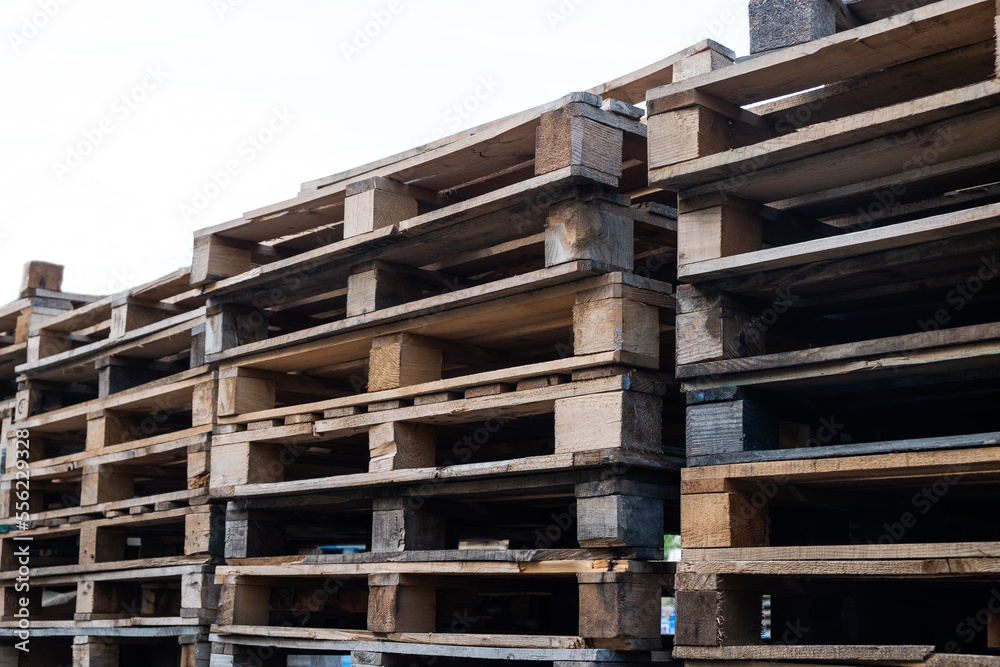 The wooden pallets stacked on top of each other
