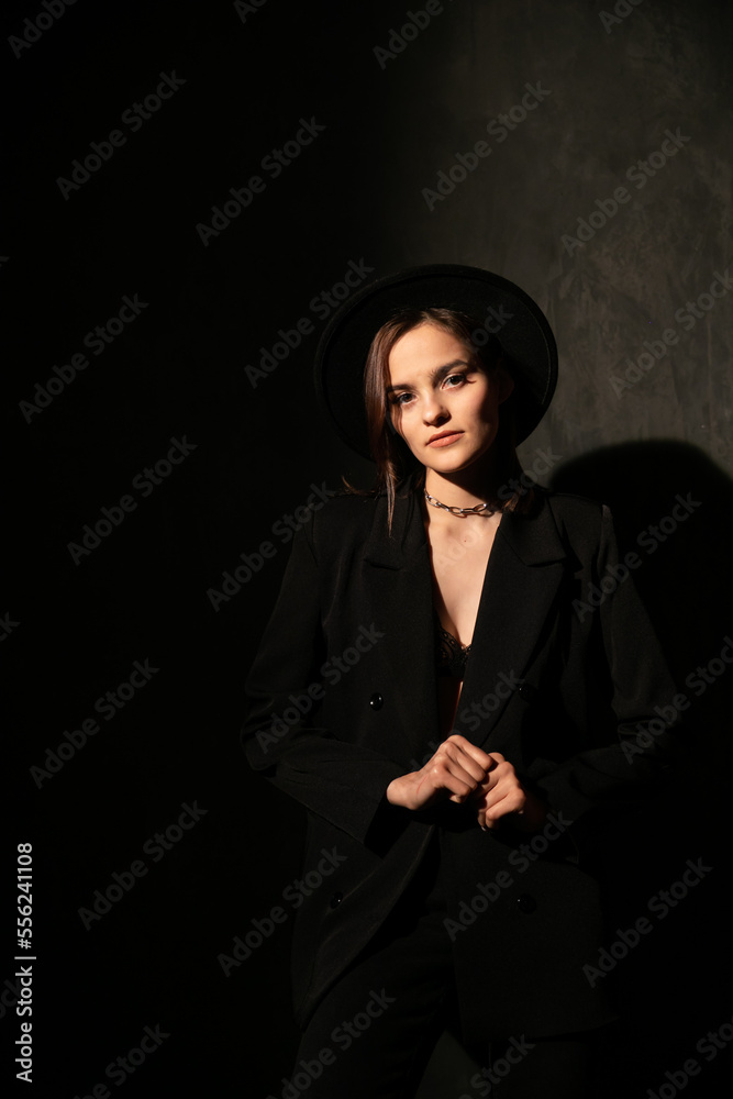 beautiful brunette woman in black clothes in the dark beautiful brunette woman in black clothes in the dark