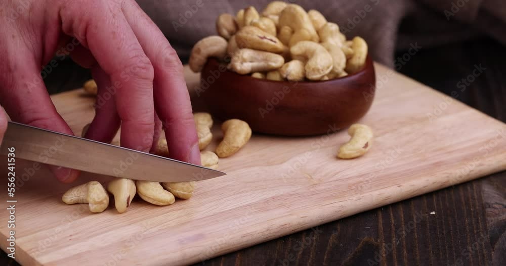 Cut large and hard cashew nuts into pieces and crumbs, peeled cashew nuts during grinding